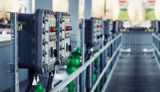 Part of power plant control panel with switches and lamps